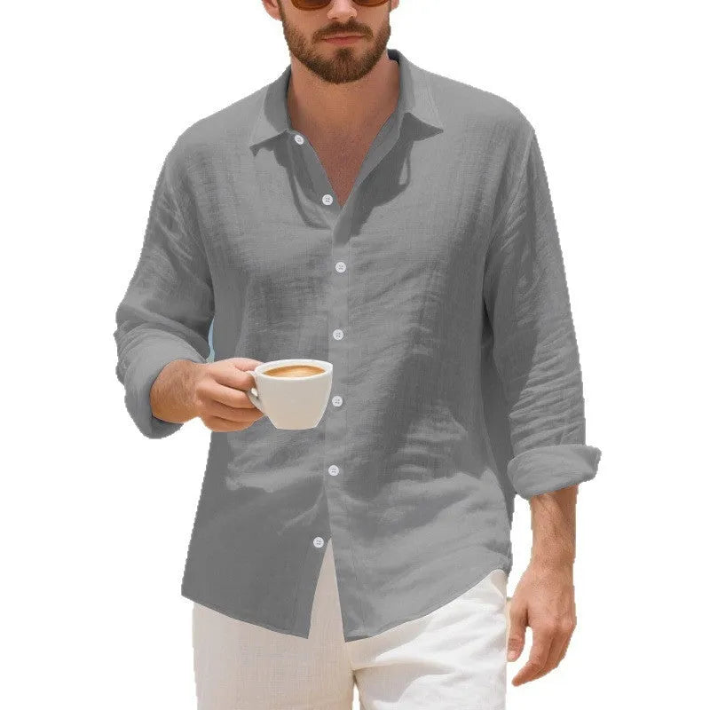 Man wearing a loose-fit linen casual shirt in a light blue colour, showing the non-iron style.