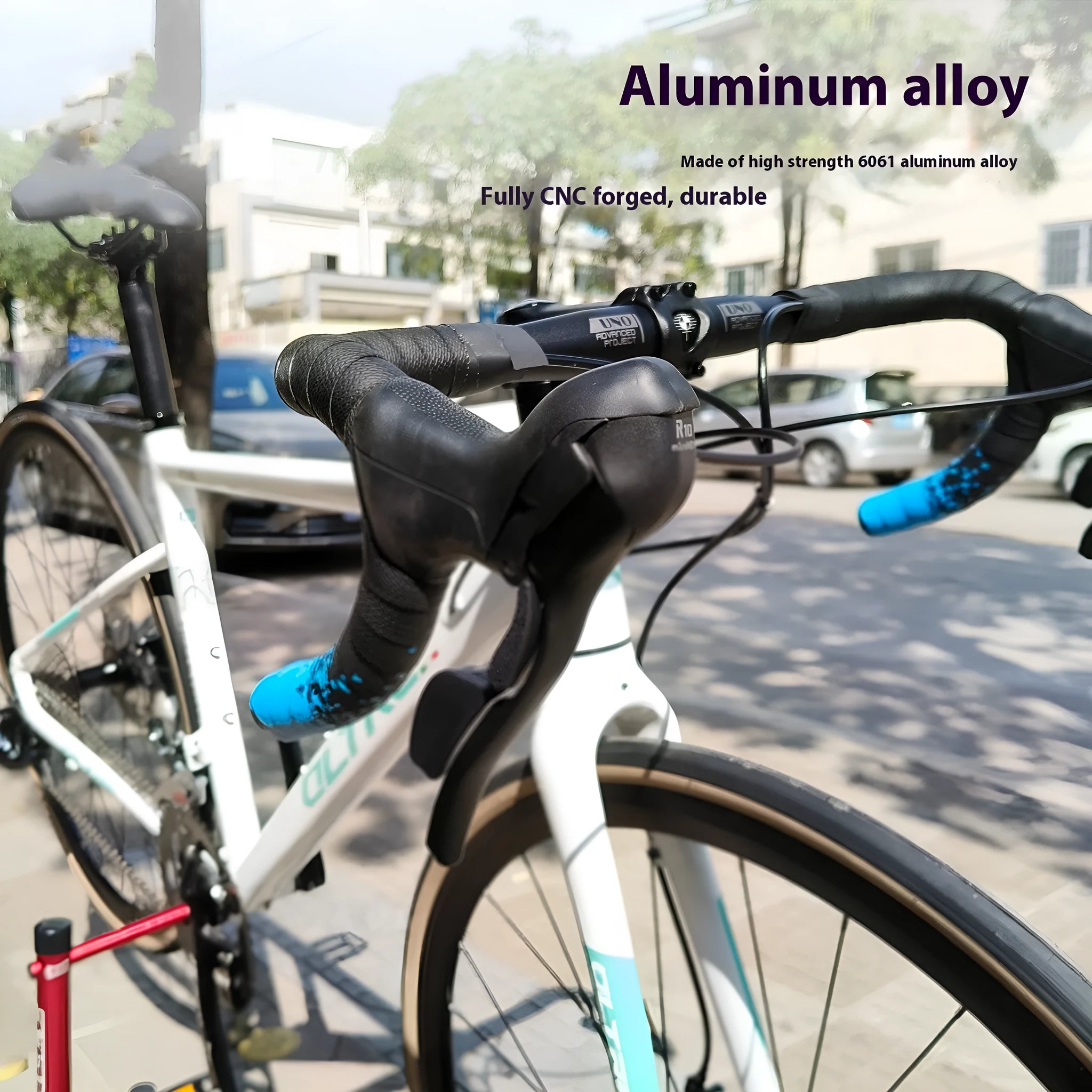 Black aluminium alloy road bike drop handlebar with printed width markings showing 31.8mm clamp diameter