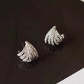 Geometric zircon earrings with platinum electroplated finish and line design detailing