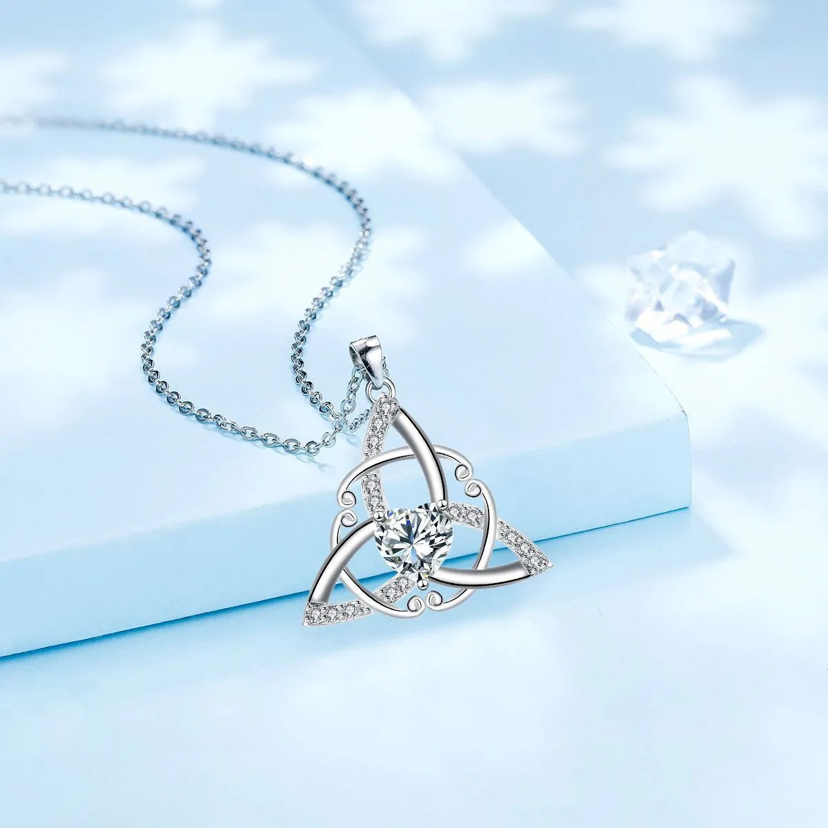 Geometric Celtic knot copper necklace for women in blue electroplated finish.