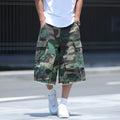 Man's loose-fit cotton shorts in a camouflage print with a cropped length and retro workwear style.