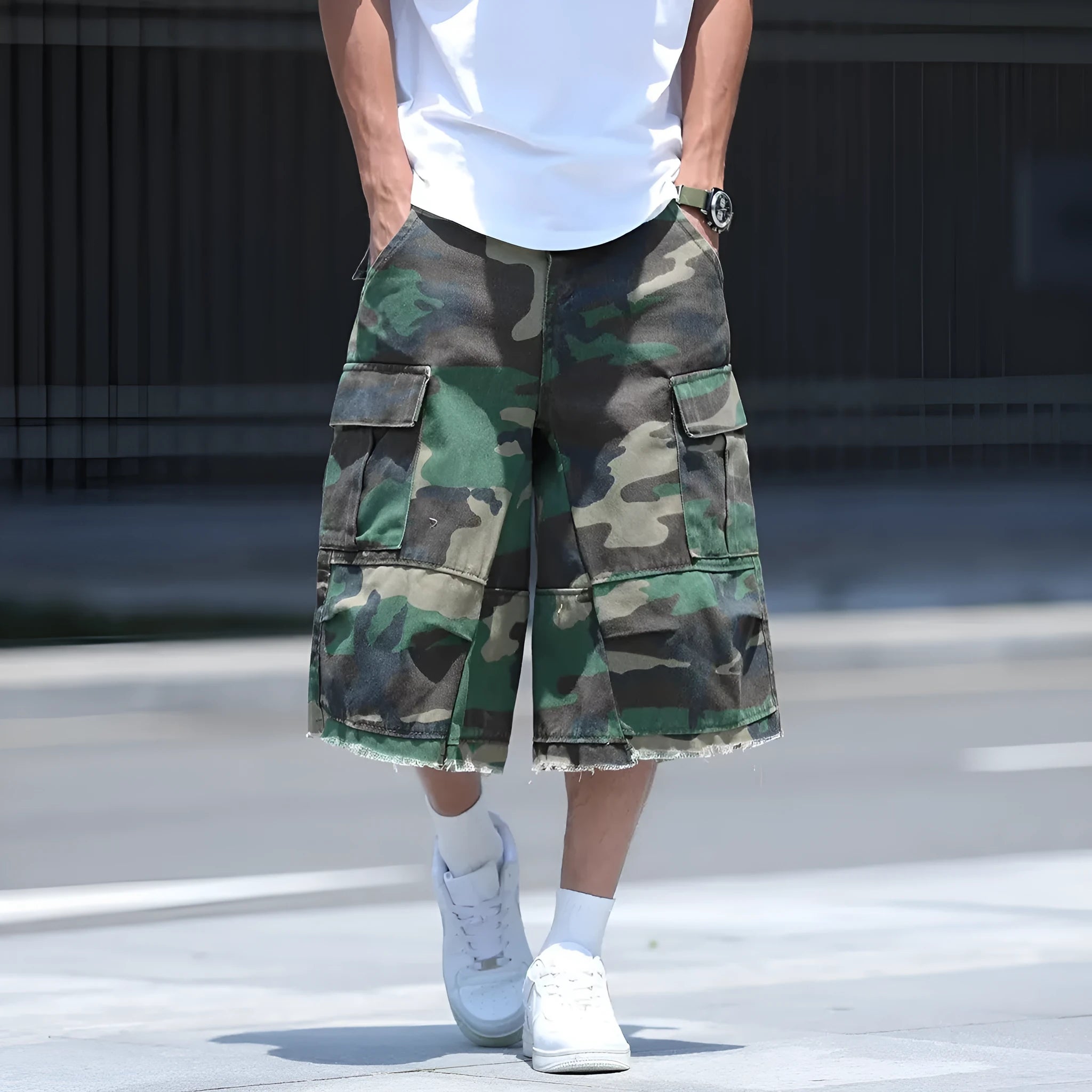Man's loose-fit cotton shorts in a camouflage print with a cropped length and retro workwear style.