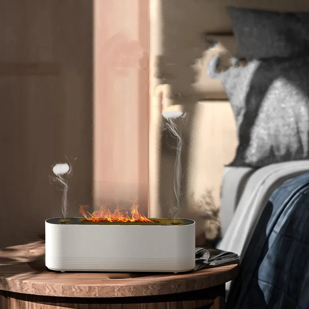 Black and white ultrasonic flame air humidifier and aroma diffuser with LED lights on a table.