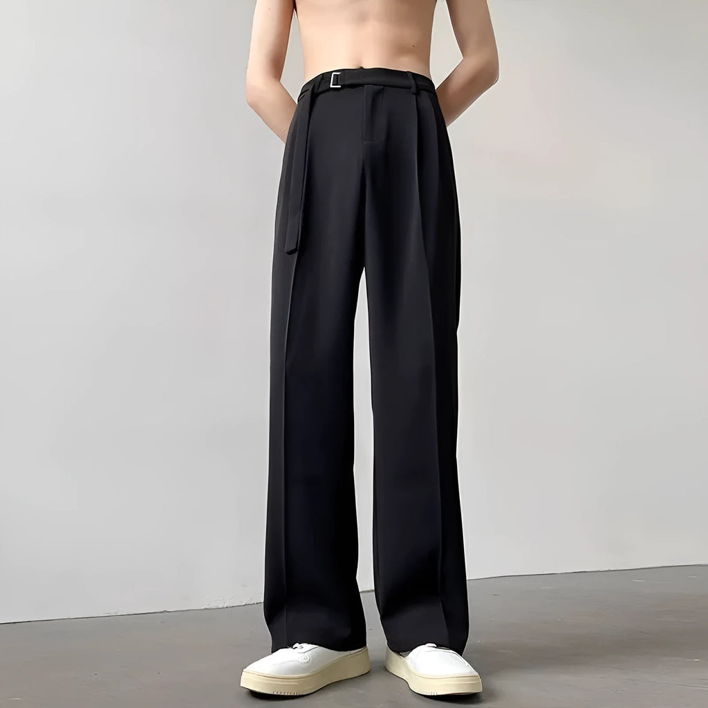 Black loose-fit wide-leg trousers with straight cut on a hanger.