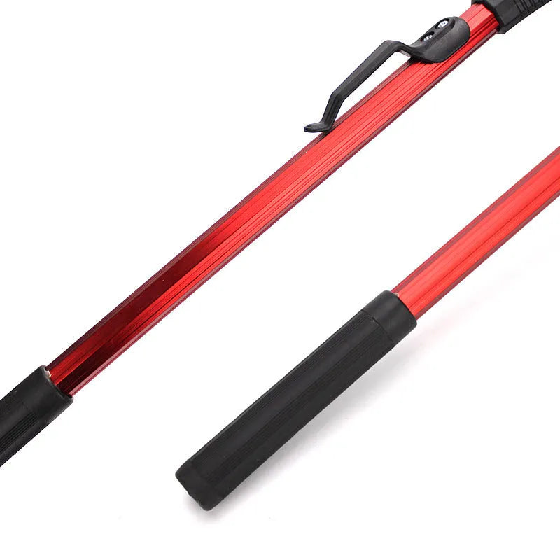 Red aluminium alloy triangular folding dip net collapsed to 47cm length on grass