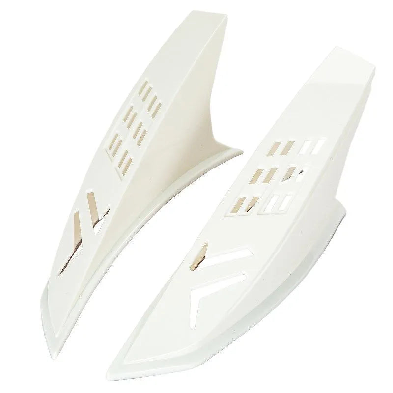 A pair of black decorative horns for a children's helmet with 3M adhesive backing.