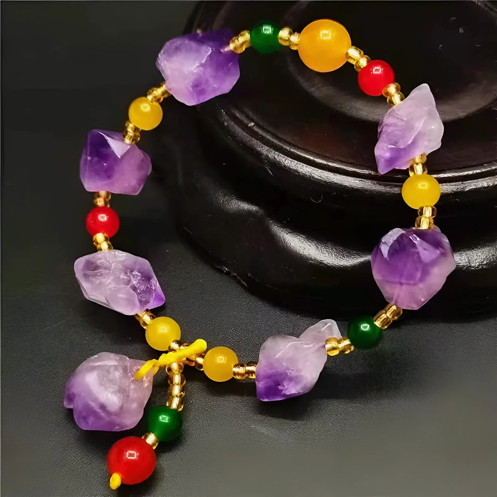 Natural amethyst bracelet with fu charm on woman's wrist