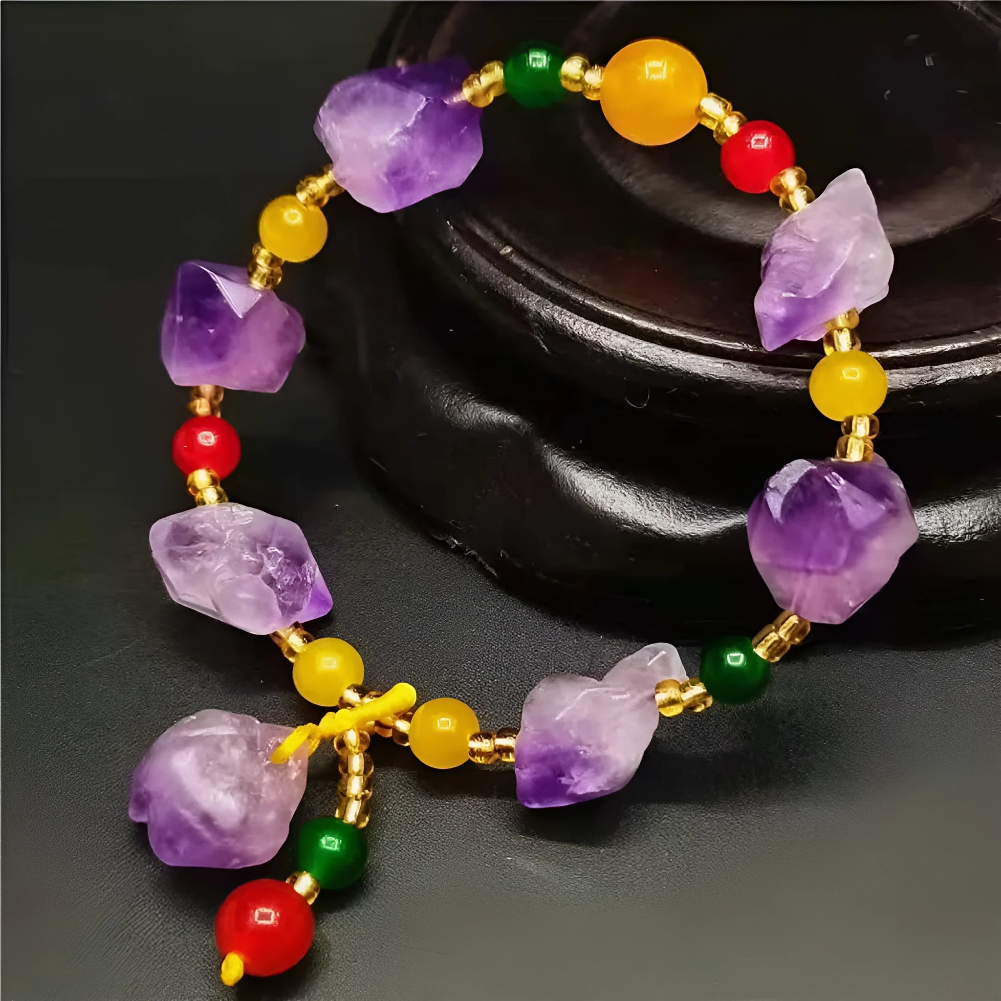 Natural amethyst bracelet with fu charm on woman's wrist