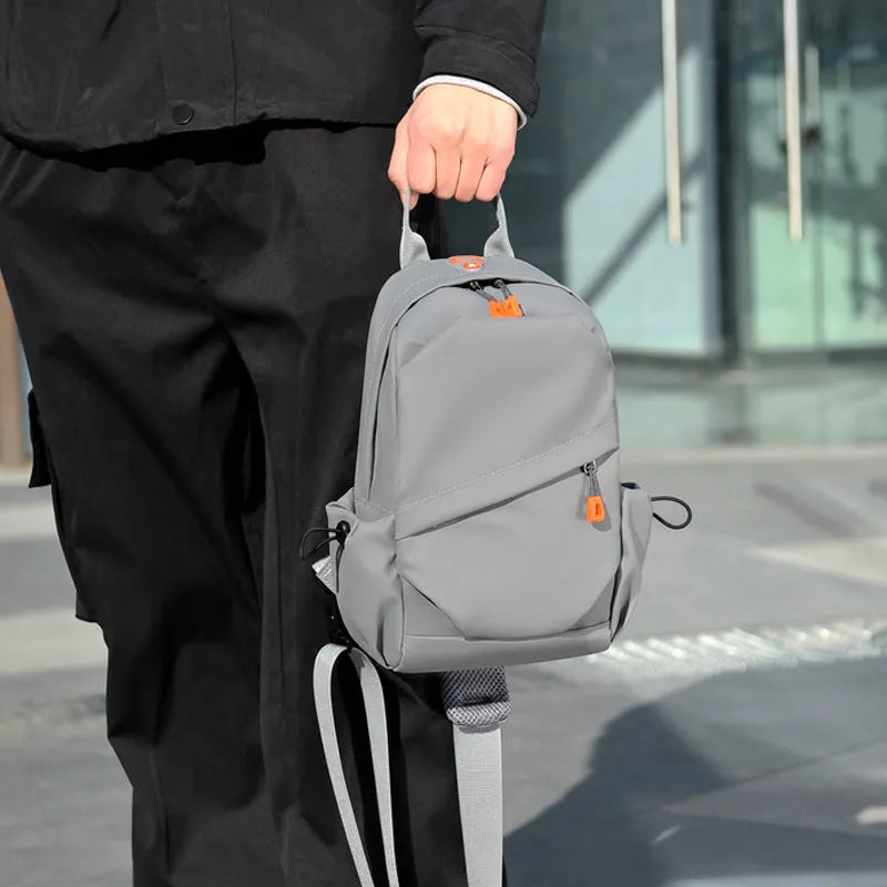 Men's black polyester crossbody bag with waterproof coating and shoulder strap