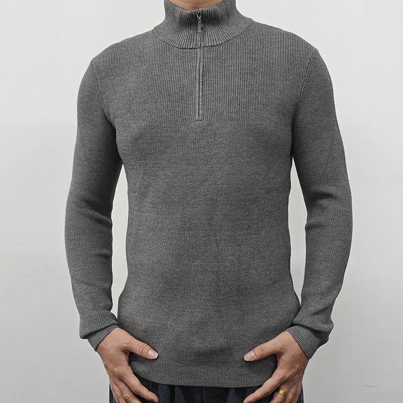 Men's grey half-turtleneck zip front sweater with long sleeves on a hanger.
