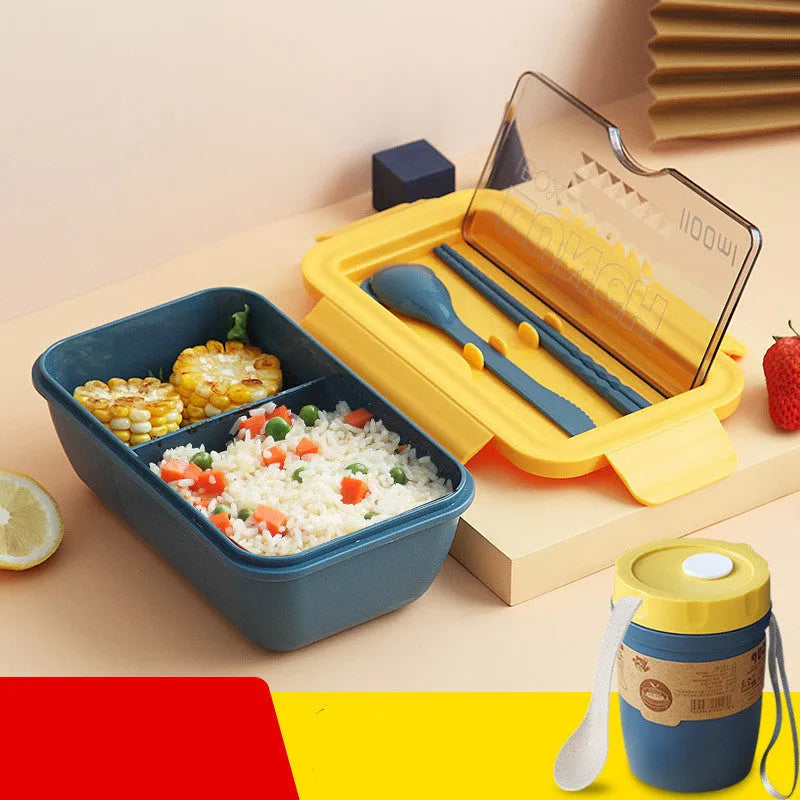 Green partitioned bento box with four food compartments showing Nordic design