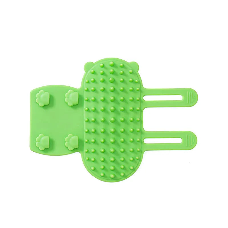 Silicone cat grooming massage comb with rounded teeth and adjustable mounting strap in assorted colours