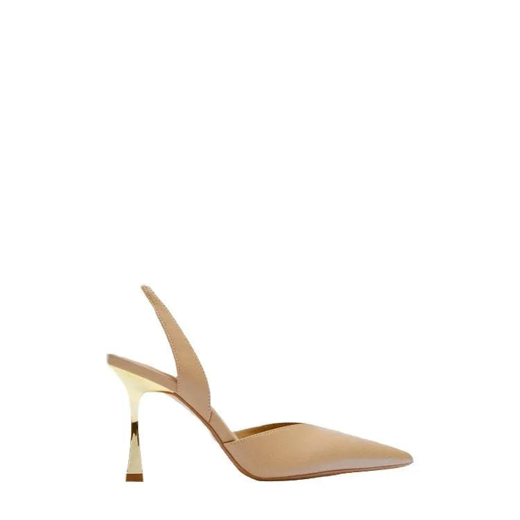 Women's pointed patent leather high heels in nude apricot colour with a shallow mouth design.