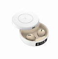 Black wireless Bluetooth earbuds with semi-in-ear design beside their wireless charging case