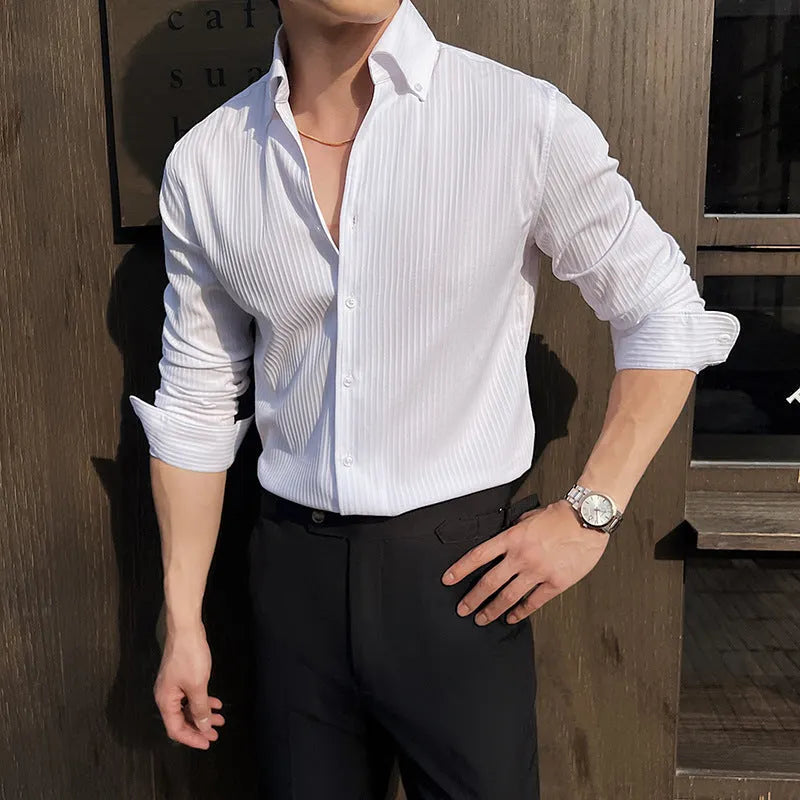 Man wearing a dark striped long sleeve V-neck cardigan shirt in a casual setting.