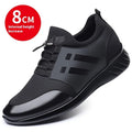 Men's black height increasing casual sneakers with chunky rubber sole and low top design.