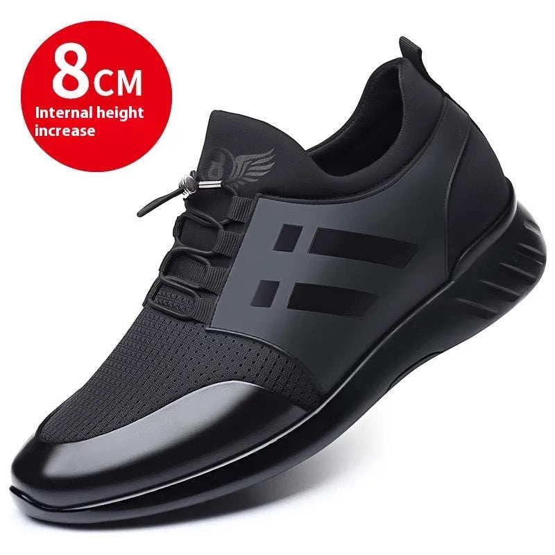 Men's black height increasing casual sneakers with chunky rubber sole and low top design.