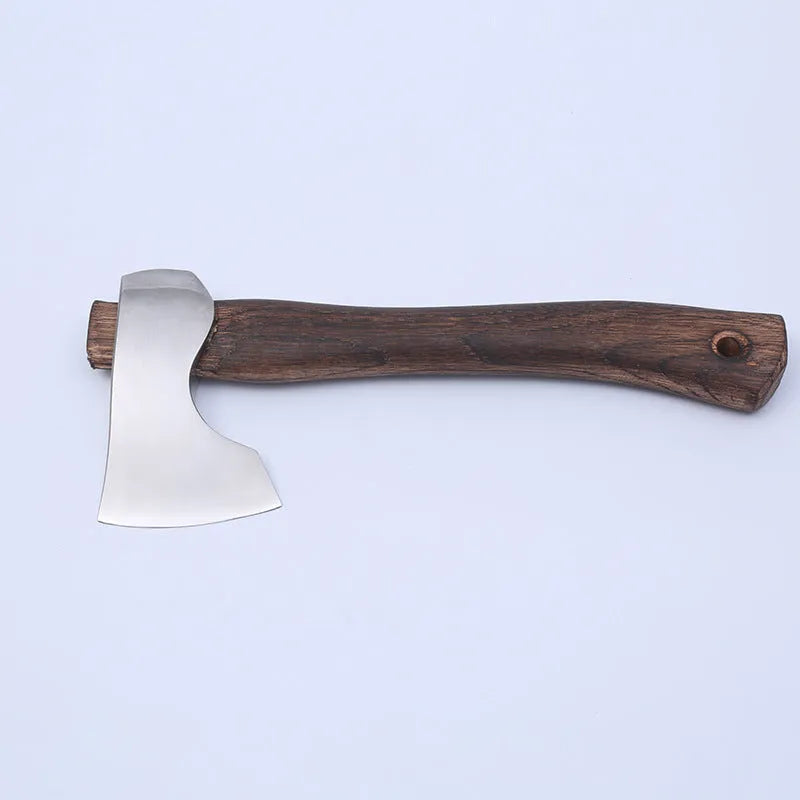 Camping axe with high carbon steel head and wooden handle on solid background