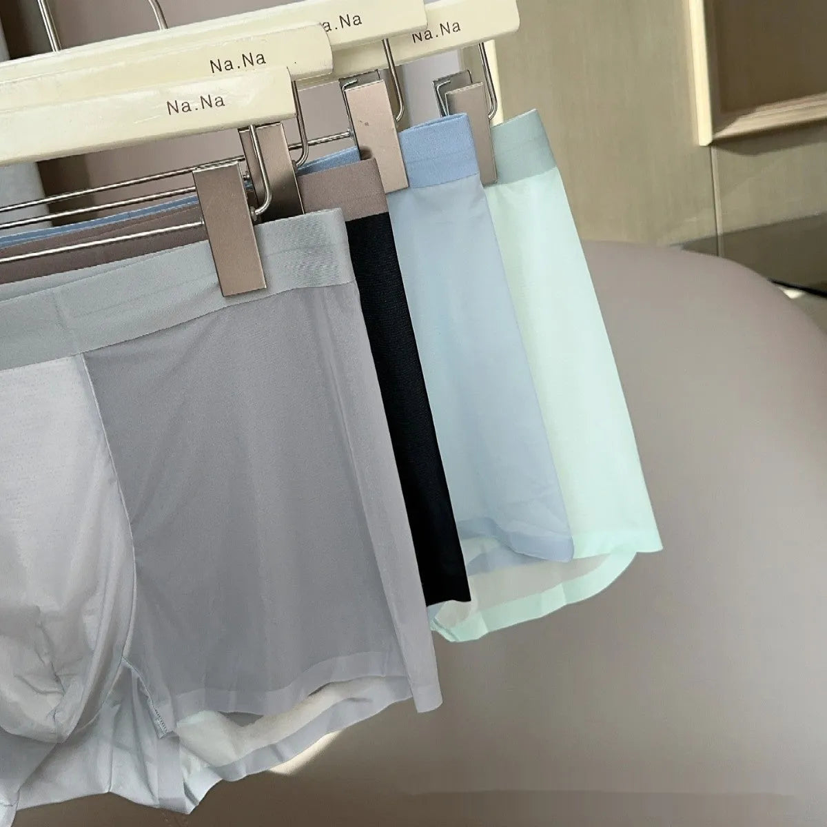 Seamless ultra-thin men's boxer shorts in Ice Silk fabric showing honeycomb crotch detail.