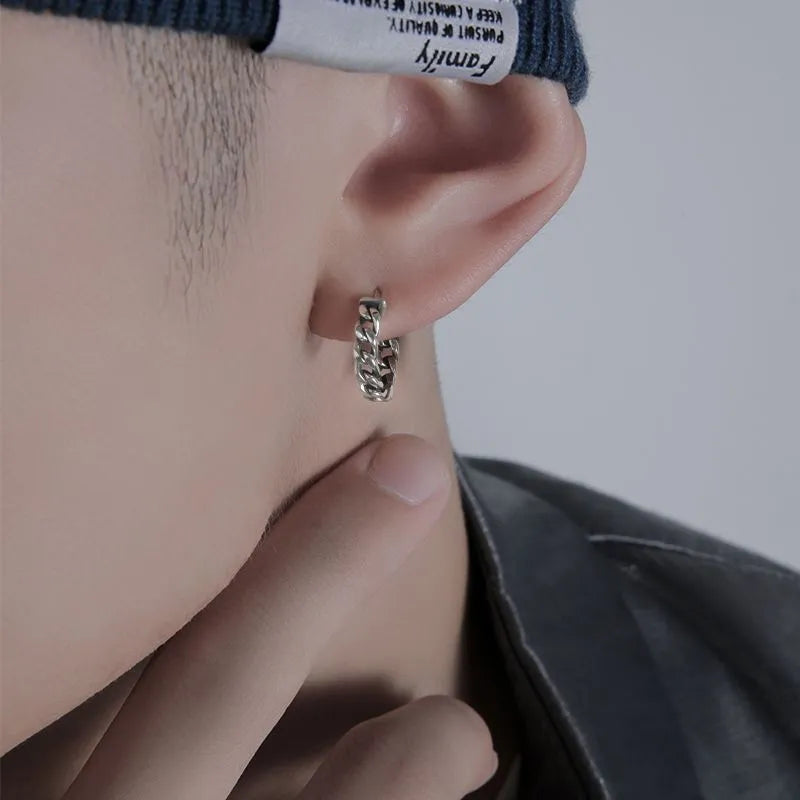 Men's geometric copper stud earrings shown in 10mm and 14mm sizes on a dark background.