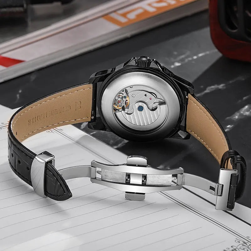 Men's automatic wristwatch with steel case, leather strap, black dial and luminous hands.
