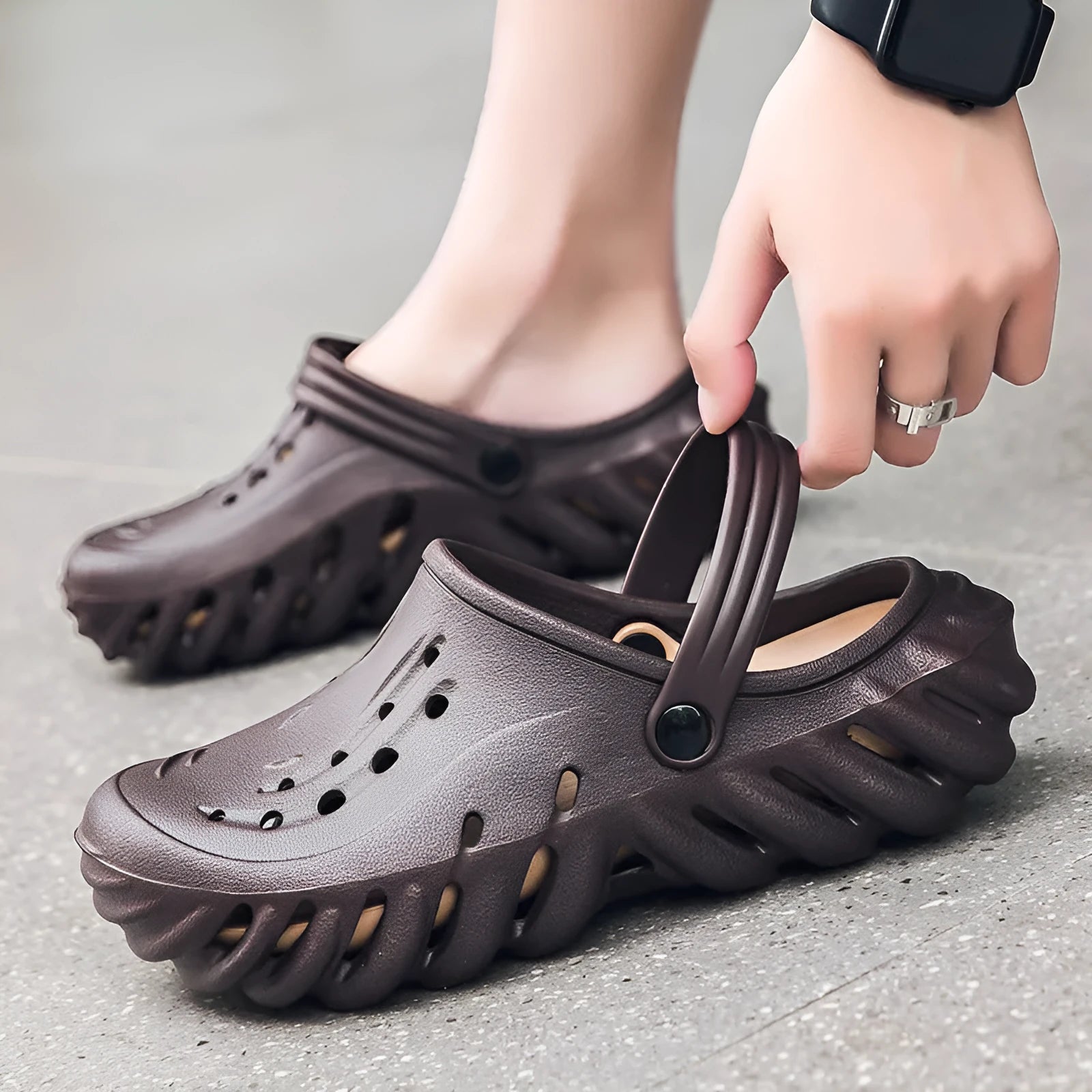 Men's beige hollow out slippers with non-slip soles showing EVA construction and round toe design