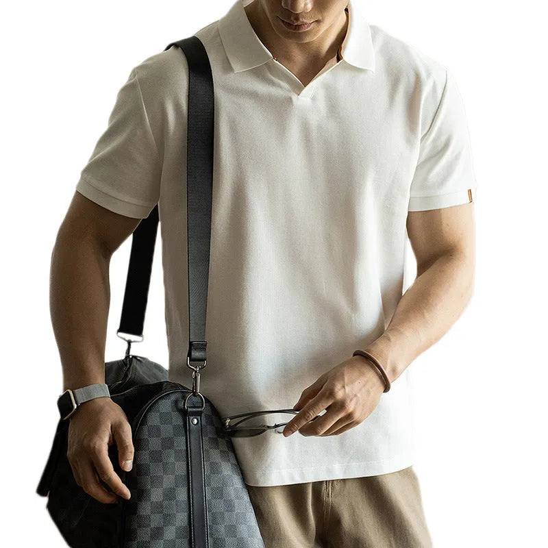Men's blue cotton blend short-sleeve polo shirt on a hanger, showing the collar and regular fit.