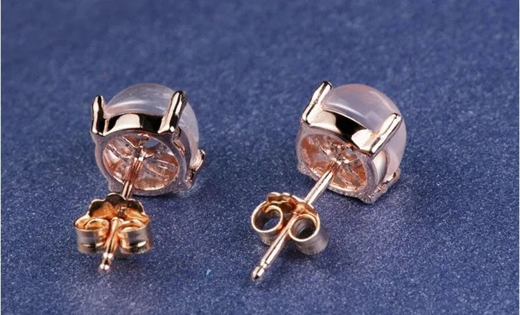 Women's rose gold plated silver earrings with synthetic quartz drop shape design
