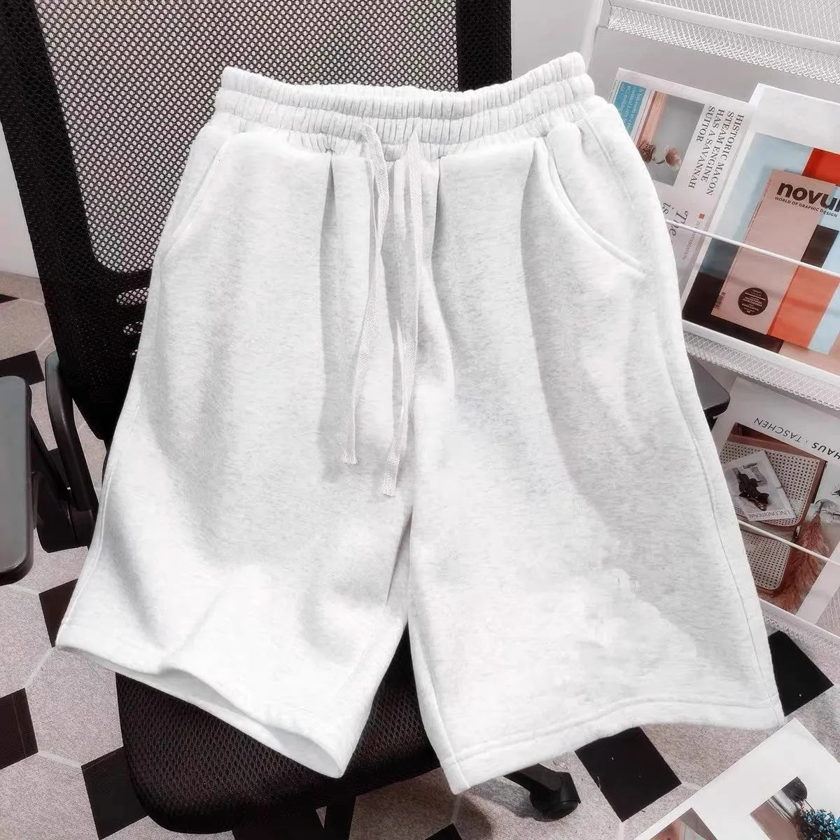 Men's loose fit polyester casual shorts in solid colour for summer, side view