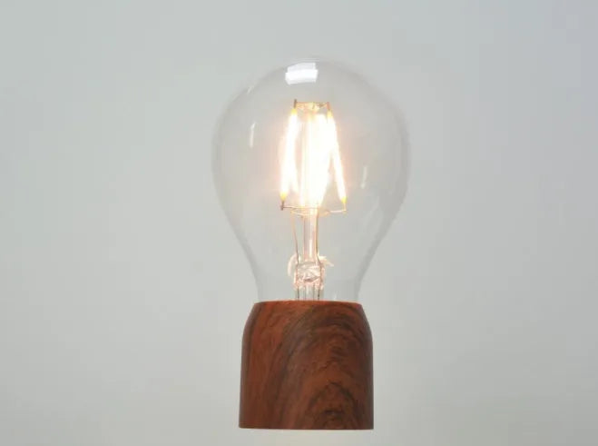Magnetic levitation floating light bulb with imitation wood base