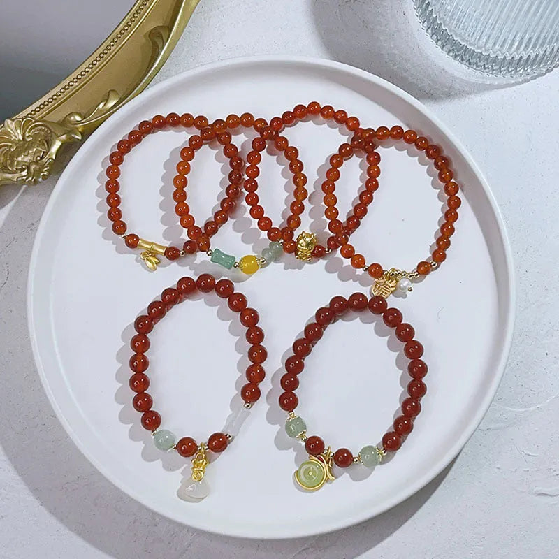 Red agate bracelet for women with dragon motifs and traditional Chinese lucky charms