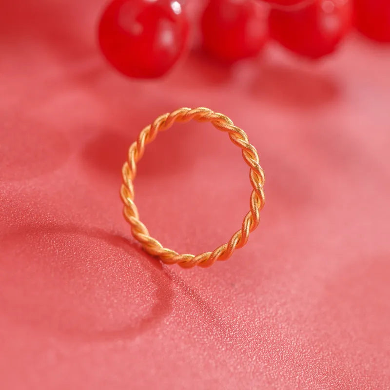 Women's brass gold plated ring shown in simple bracelet and twist ring styles.
