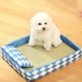 Blue rattan weave cat mat with non-slip base shown in size L, placed on a wooden floor.