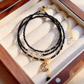 Close-up of a blue sandstone and gold multi-layer three-ring bracelet for women.