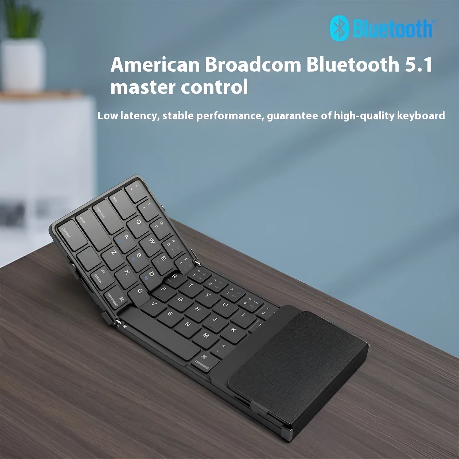 Black folding Bluetooth keyboard for mobile phones and tablets, shown both open and closed.