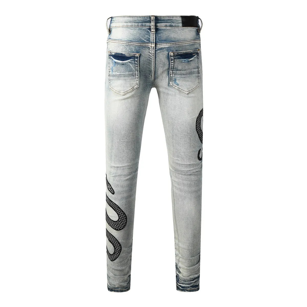 Blue distressed street fashion skinny jeans with a button fly and mid-rise waist on a hanger.
