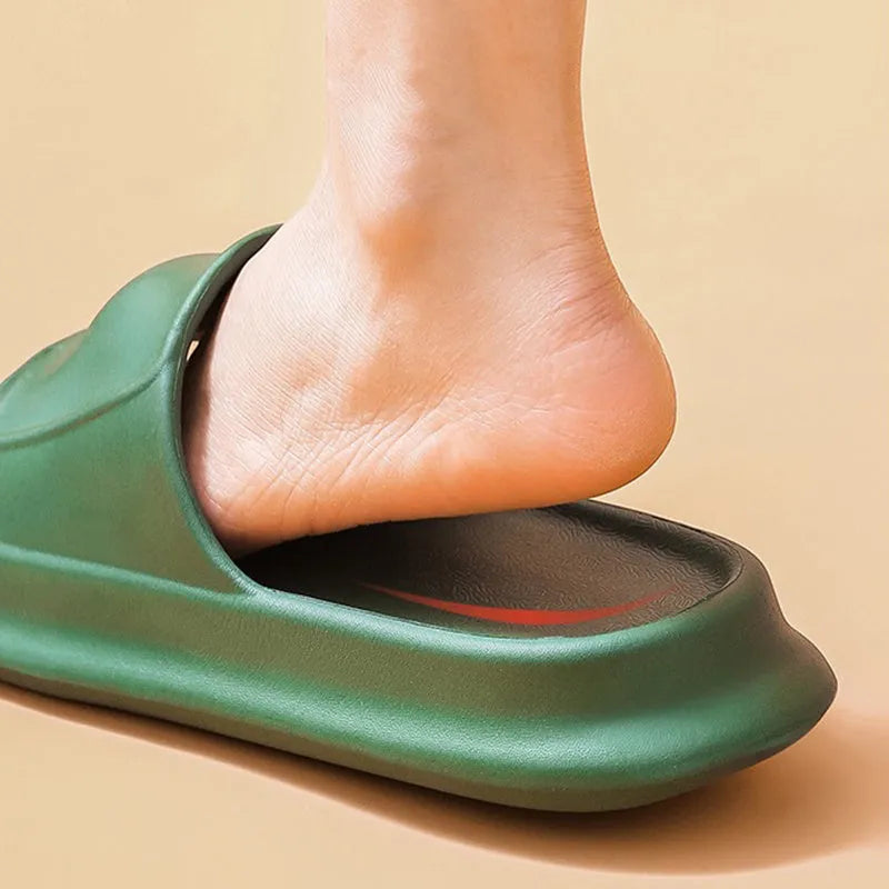 A pair of thick-soled, soft EVA flip-flop slippers with a non-slip tread pattern.