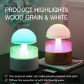White cloud-shaped ultrasonic humidifier and aroma diffuser with simulated rain drops and coloured light.
