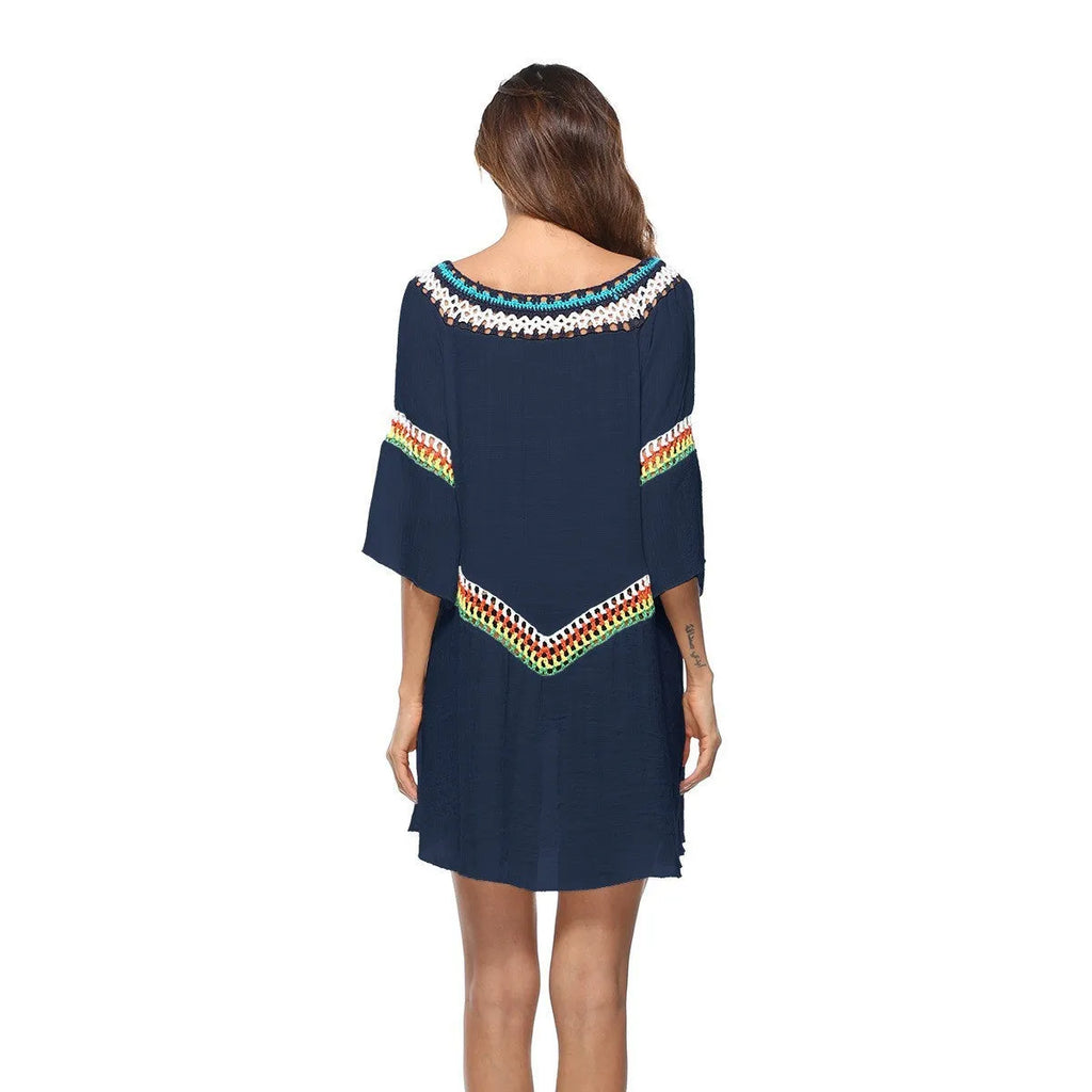 Crocheted ethnic-style white acrylic beach cover-up for women on a mannequin