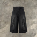 Men's black denim shorts with a cropped flame embroidery patch on the leg