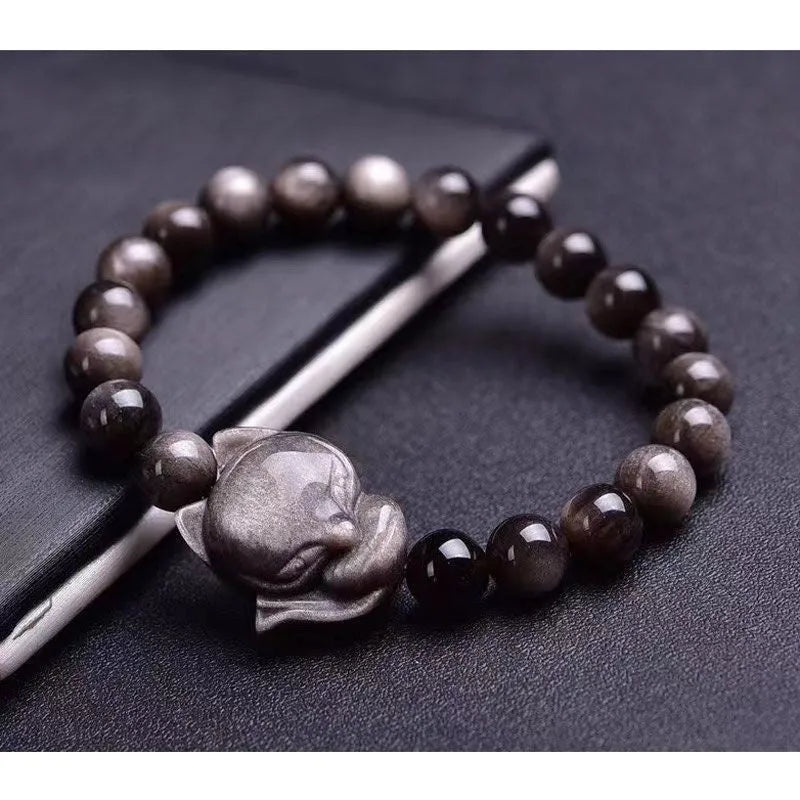 Obsidian fox charm bracelet with 8mm polished stone pendant on a black elastic cord.