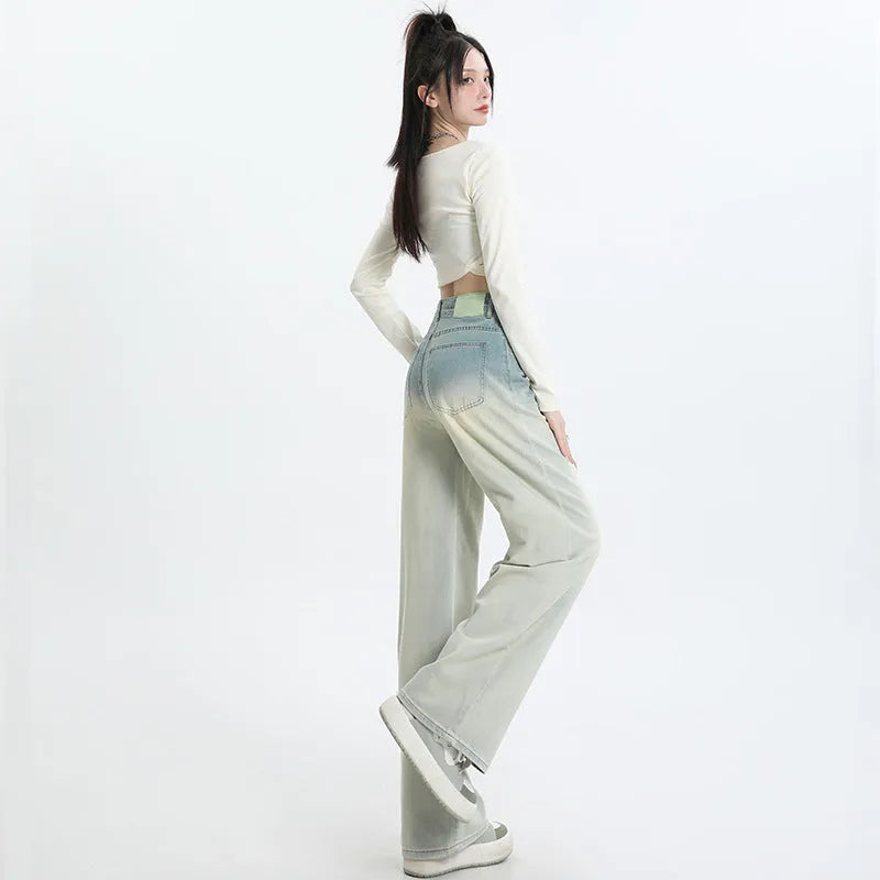 Women's gradient blue denim straight-leg trousers with wide-leg styling on size chart background