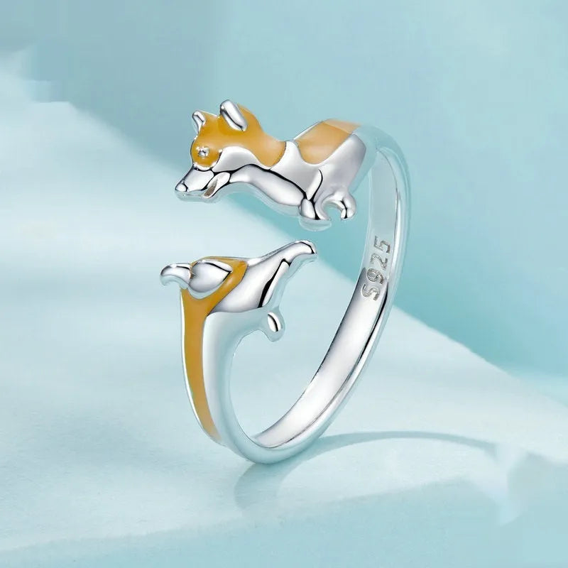 Silver-coloured adjustable ring with a detailed cartoon Corgi dog design.