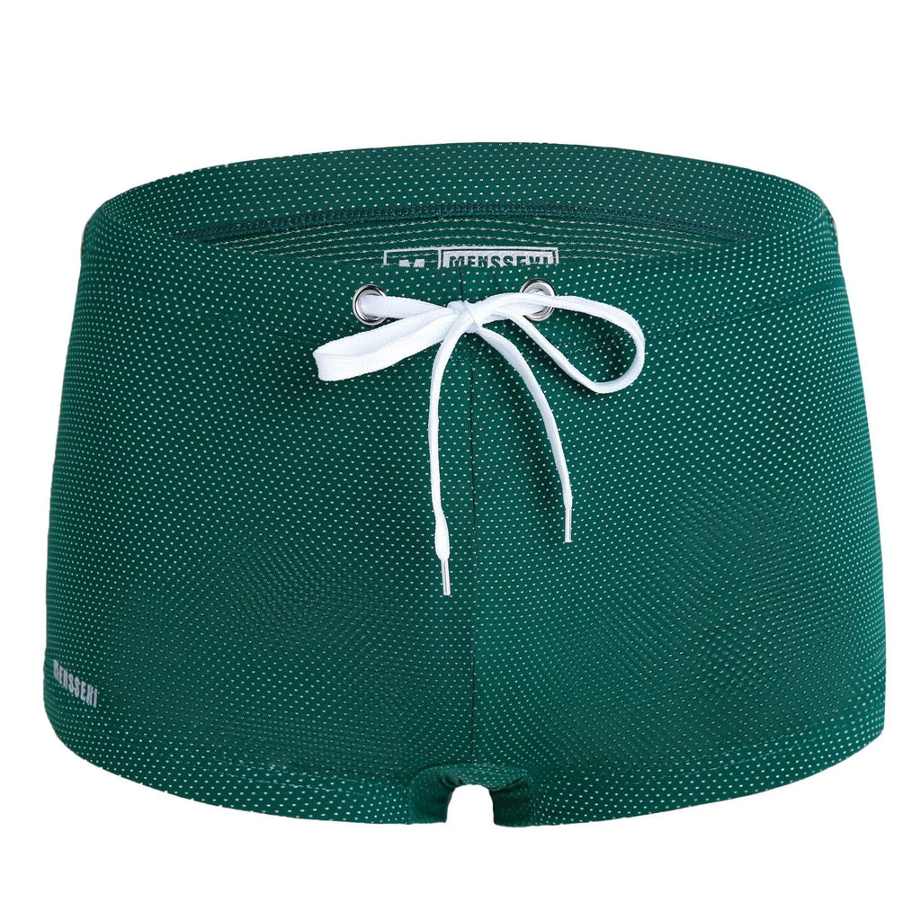 Men's low-waist boxer style swimming trunks in nylon, available in multiple colours.