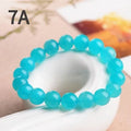 Grade 7A Amazonite natural scattered beads in ice blue and green, showing polished round and three-ring bead styles for bracelet making.
