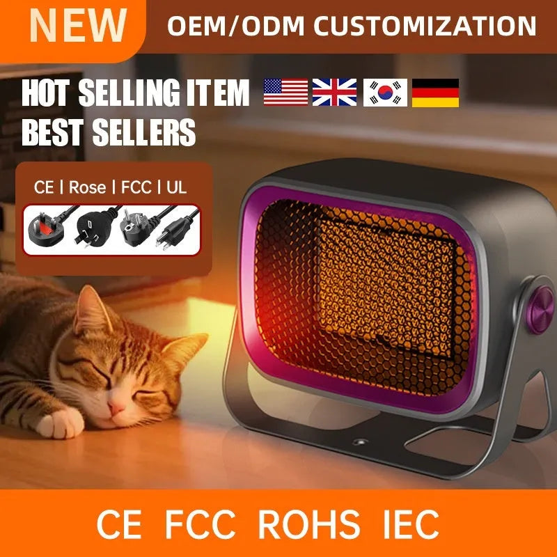 Compact grey desktop ceramic heater with rotatable grill on a wooden desk.