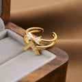 Women's open geometric fashion ring in electroplated gold colour on a copper base.