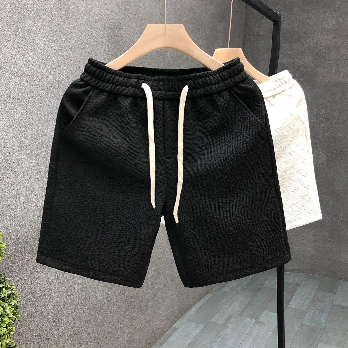 White jacquard shorts for men with straight cut and micro elastic fabric, displayed on a model
