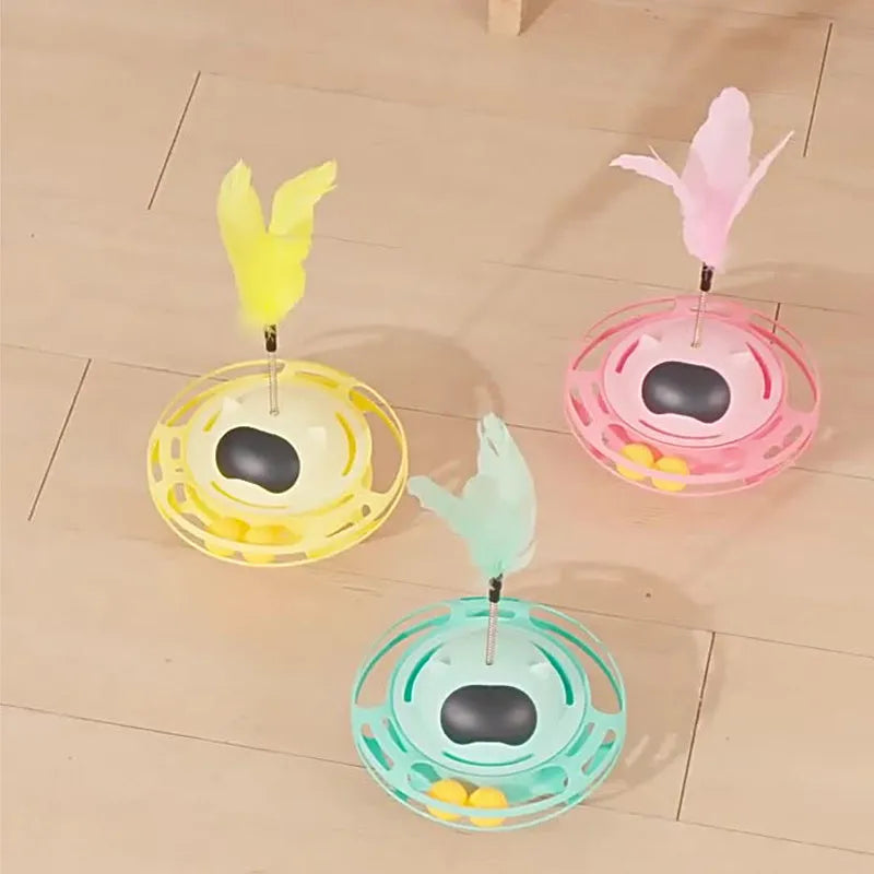 Pink cat stick toy with self-righting tumbler turntable measuring 17cm by 10cm