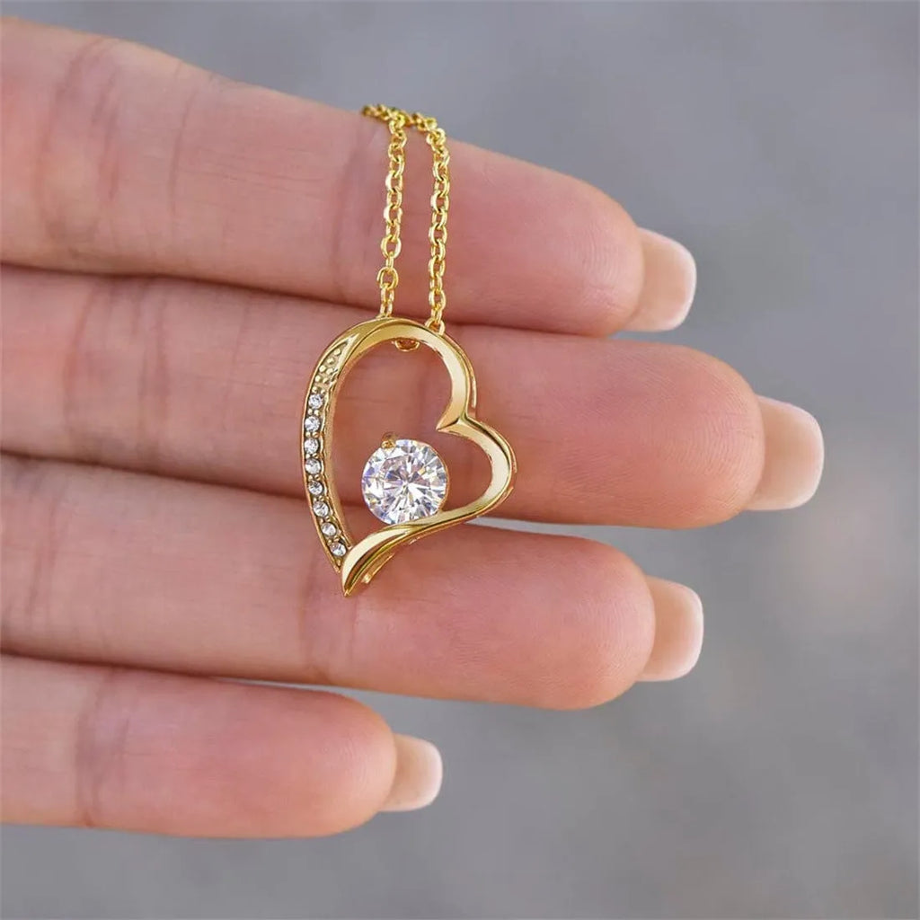 Silver and gold hollow heart necklace pendant with gift card and gift box packaging options.